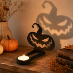 Jack-o’-Lantern halloween metal candle holder casting a spooky shadow on the wall