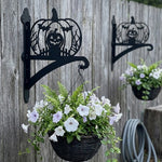 Jack-o’-lantern metal hanging basket bracket mounted on outdoor wall for plant decoration