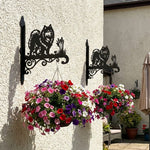 Keeshond metal hanging basket bracket mounted on outdoor wall for plant decoration