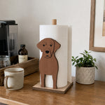 Labrador Wooden Dog Paper Towel Holder displayed on a kitchen countertop with a freestanding paper towel roll