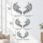 Black metal Love Angel wings wall art with intricate cutout details displayed on the wall