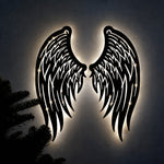 Black metal Angel wings wall art with Soft White LED Lighting displayed on the wall