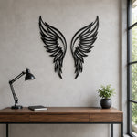 Black metal Butterfly wings wall art with intricate cutout details displayed on the wall