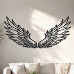 Black metal Celestial Angel wings wall art with intricate cutout details displayed on the wall