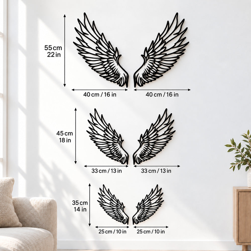 Black metal Celestial Angel wings wall art with intricate cutout details displayed on the wall