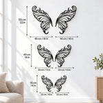 Black metal Elegant Butterfly wings wall art with intricate cutout details displayed on the wall