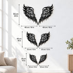 Black metal Flame Style Angel wings wall art with intricate cutout details displayed on the wall