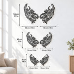 Black metal Mystic Phoenix wings wall art with intricate cutout details displayed on the wall