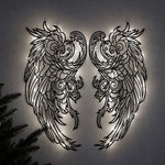 Black metal Mystic Phoenix wings wall art with Soft White LED Lighting displayed on the wall