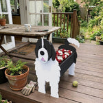 Newfoundland dog planter filled with fresh flowers is placed in the garden