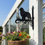Newfoundland metal hanging basket bracket mounted on outdoor wall for plant decoration