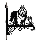 Old english sheepdog metal hanging basket bracket mounted on outdoor wall for plant decoration