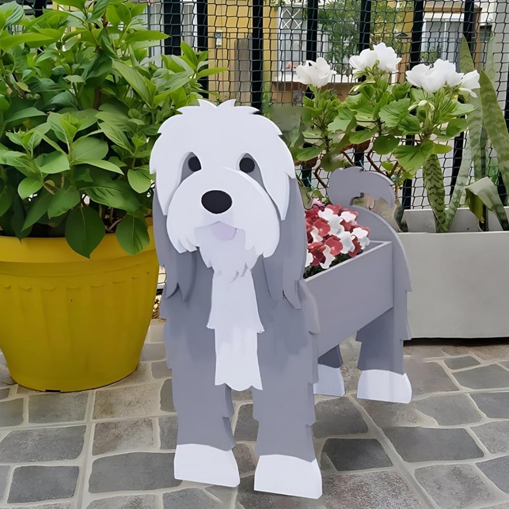 Old English Sheepdog  planter filled with fresh flowers is placed in the garden