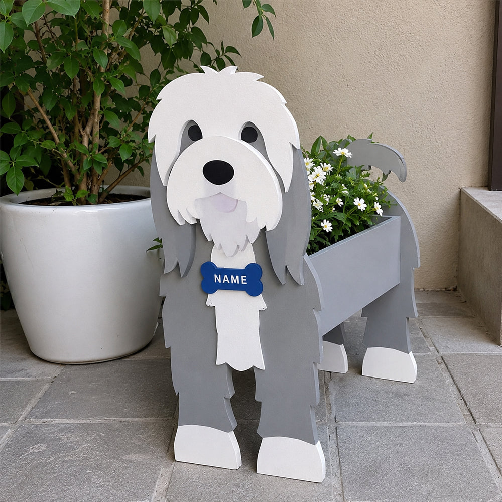 Old English Sheepdog  planter filled with fresh flowers is placed in the garden