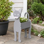 Oriental Shorthair cat planter filled with fresh flowers is placed in the garden