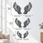 Black metal Ornate Angel wings wall art with intricate cutout details displayed on the wall