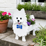 Pomeranian dog planter filled with fresh flowers is placed in the garden