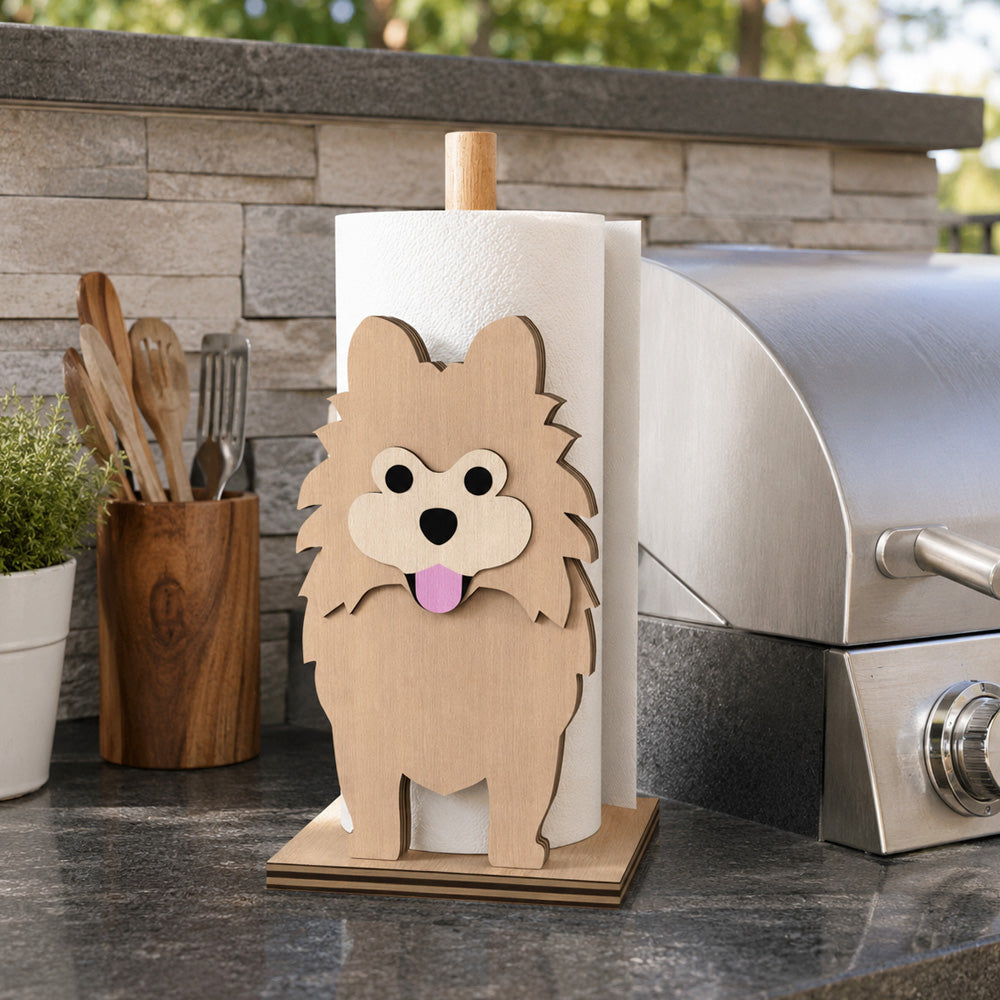 Pomeranian Wooden Dog Paper Towel Holder displayed on a kitchen countertop with a freestanding paper towel roll