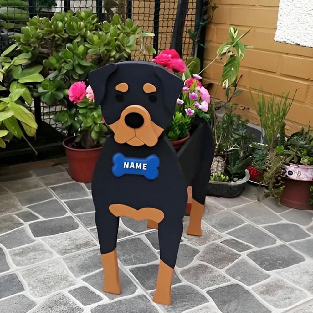 Rottweiler dog planter filled with fresh flowers is placed in the garden