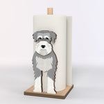 Schnauzer Wooden Dog Paper Towel Holder displayed on a kitchen countertop with a freestanding paper towel roll