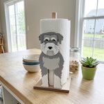 Schnauzer Wooden Dog Paper Towel Holder displayed on a kitchen countertop with a freestanding paper towel roll