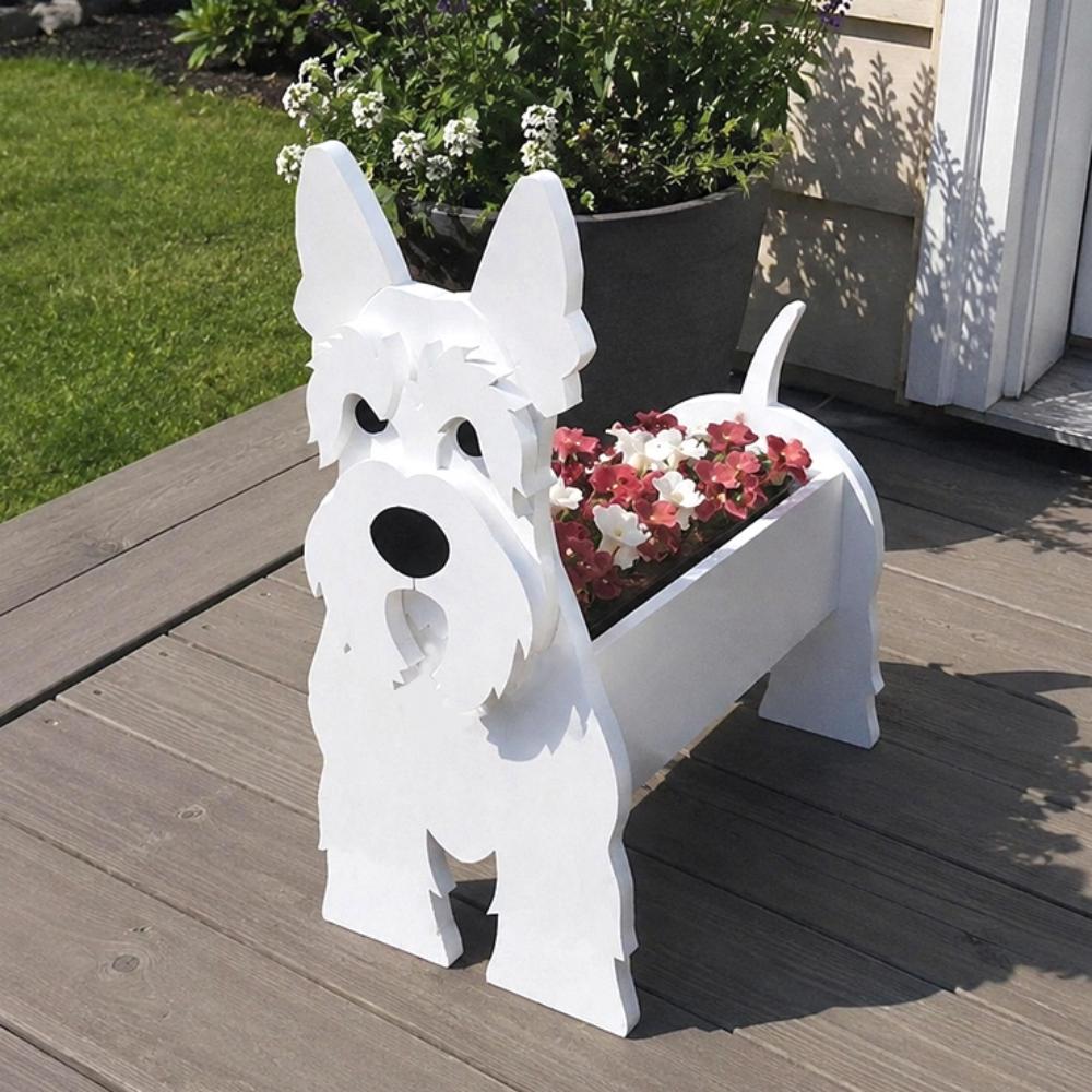 Scottish Terrier dog planter filled with fresh flowers is placed in the garden