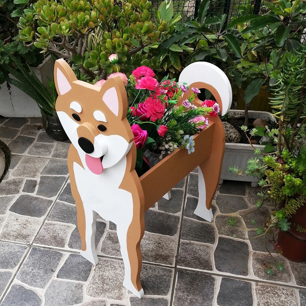 Shiba Inu dog planter filled with fresh flowers is placed in the garden