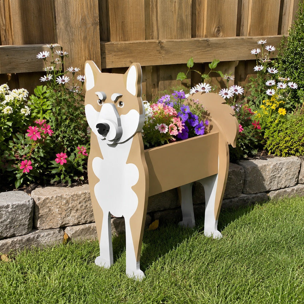 Shiba Inu dog planter filled with fresh flowers is placed in the garden