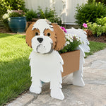 Shih Tzu dog planter filled with fresh flowers is placed in the garden