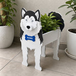 Siberian Husky dog planter filled with fresh flowers is placed in the garden