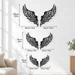 Black metal Soaring Angel Wings wall art with intricate cutout details displayed on the wall