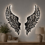 Black metal Soaring Angel Wings wall art with Soft White LED Lighting displayed on the wall