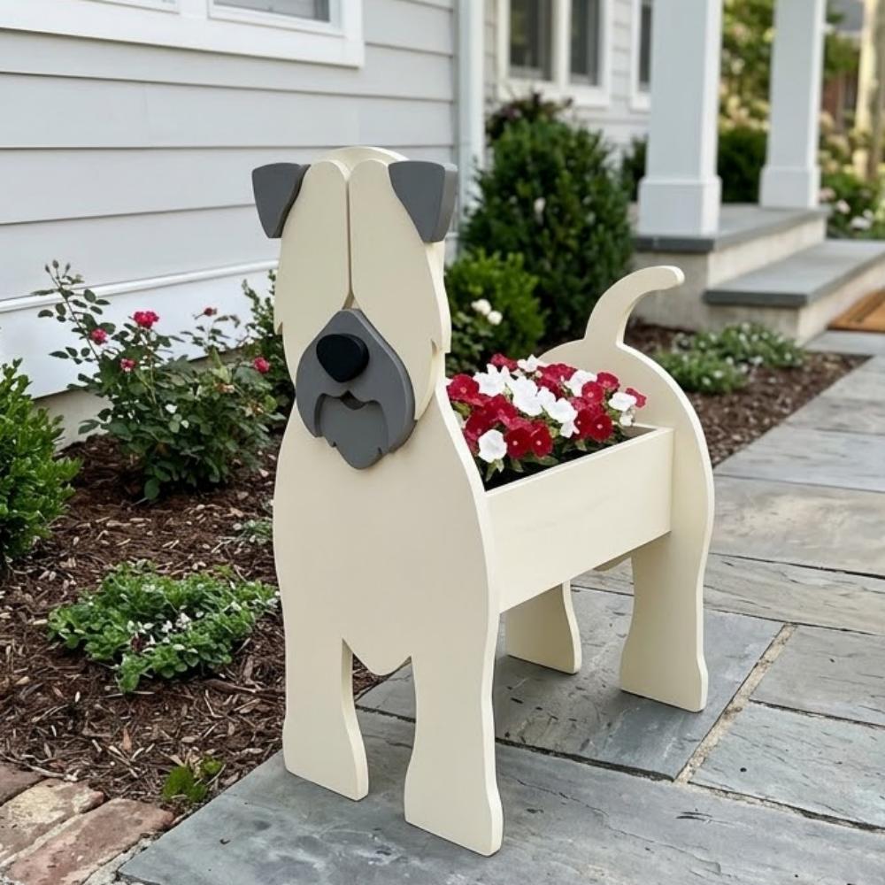 Soft Coated Wheaten Terrier dog planter filled with fresh flowers is placed in the garden