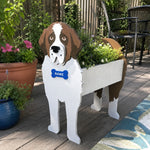 St. Bernard dog planter filled with fresh flowers is placed in the garden