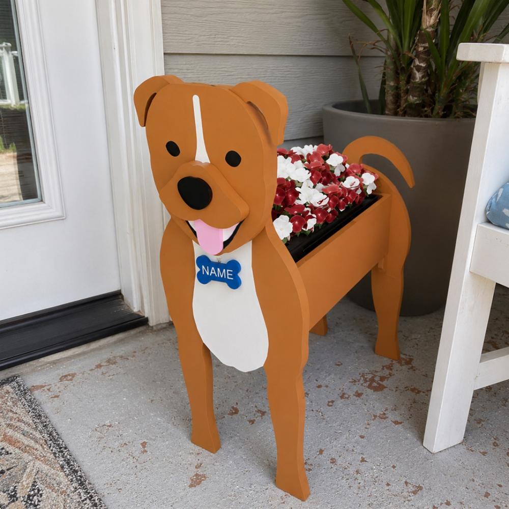 Staffordshire Bull Terrier dog planter filled with fresh flowers is placed in the garden