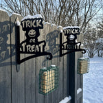 Trick or treat pumpkin metal hanging basket bracket mounted on outdoor wall for plant decoration