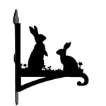 Two rabbits metal hanging basket bracket mounted on outdoor wall for plant decoration