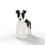 Wire Fox Terrier dog planter filled with fresh flowers is placed in the garden